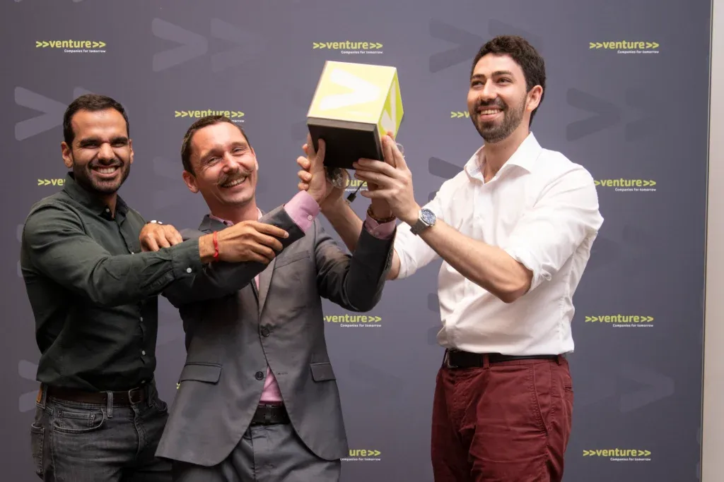DeepPsy team members holding a venture award